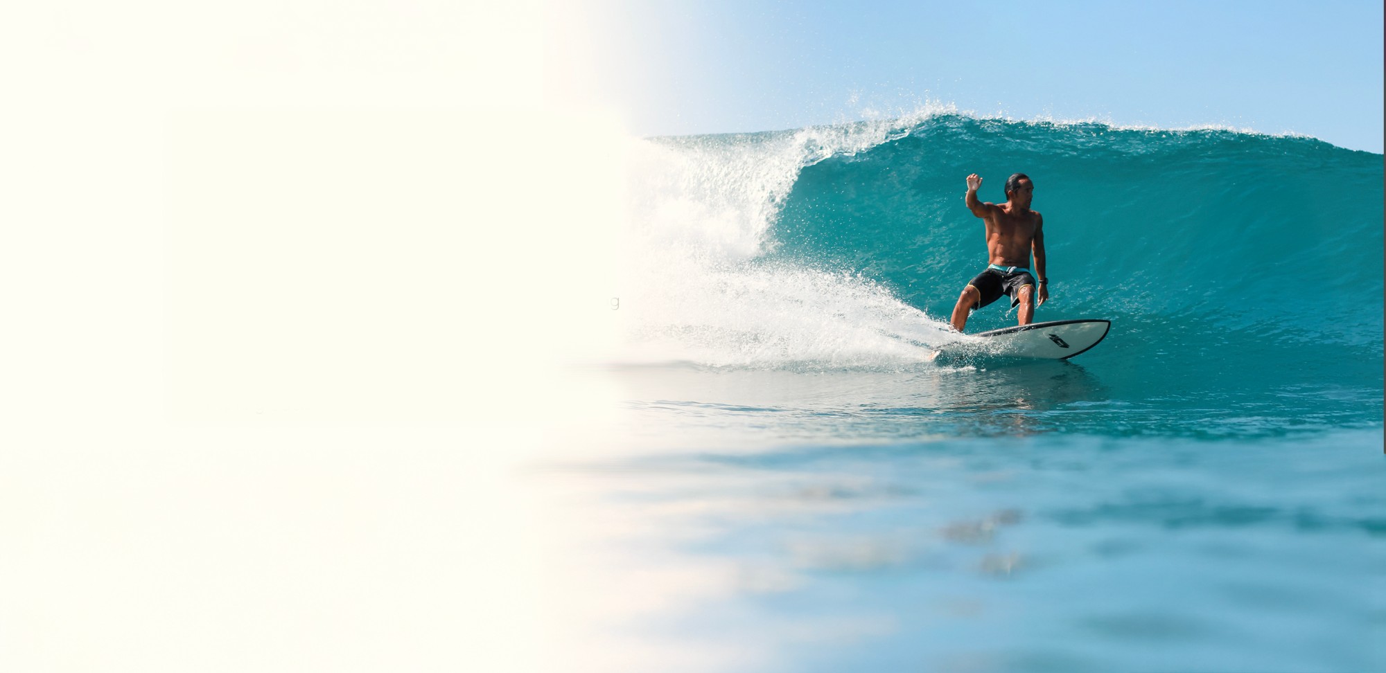 Surfer riding a wave at Playa Guiones, Nosara